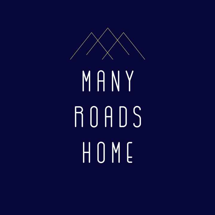 Image features a mountain scape with the words "Many Roads Home"