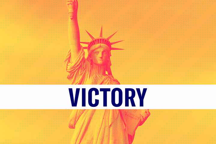 The statue of Liberty is shown behind a banner that says "VICTORY"